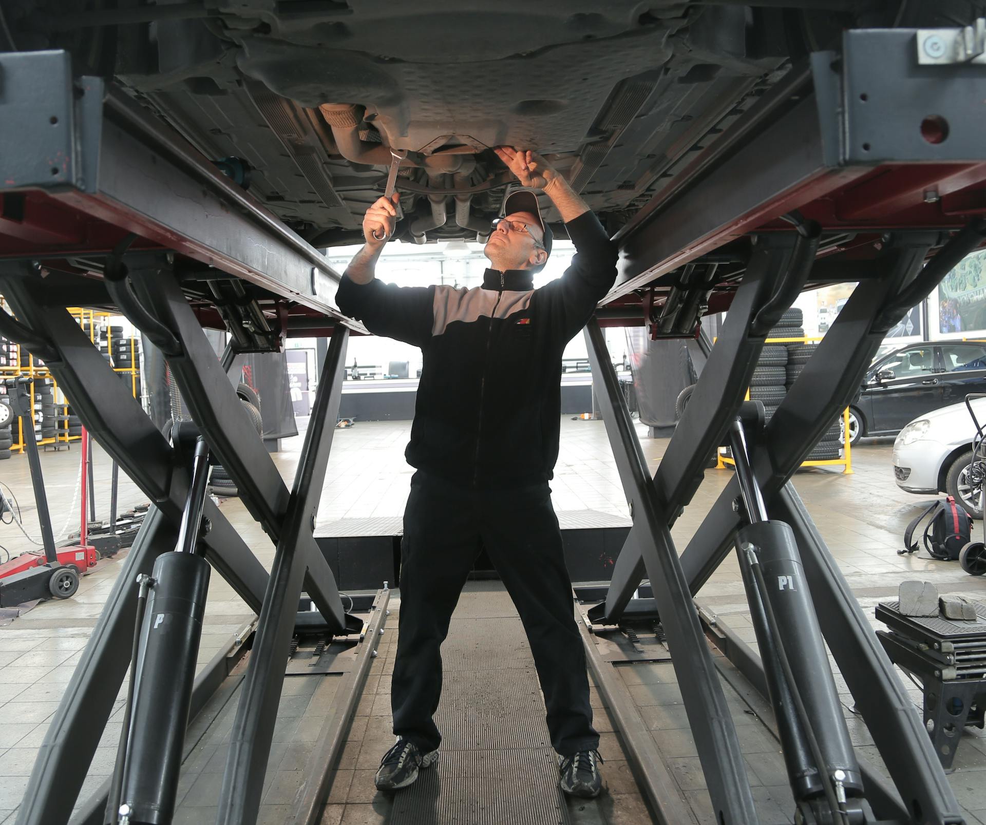 Mechanic performing electrical diagnostics on a vehicle at Pro Automotive Repair