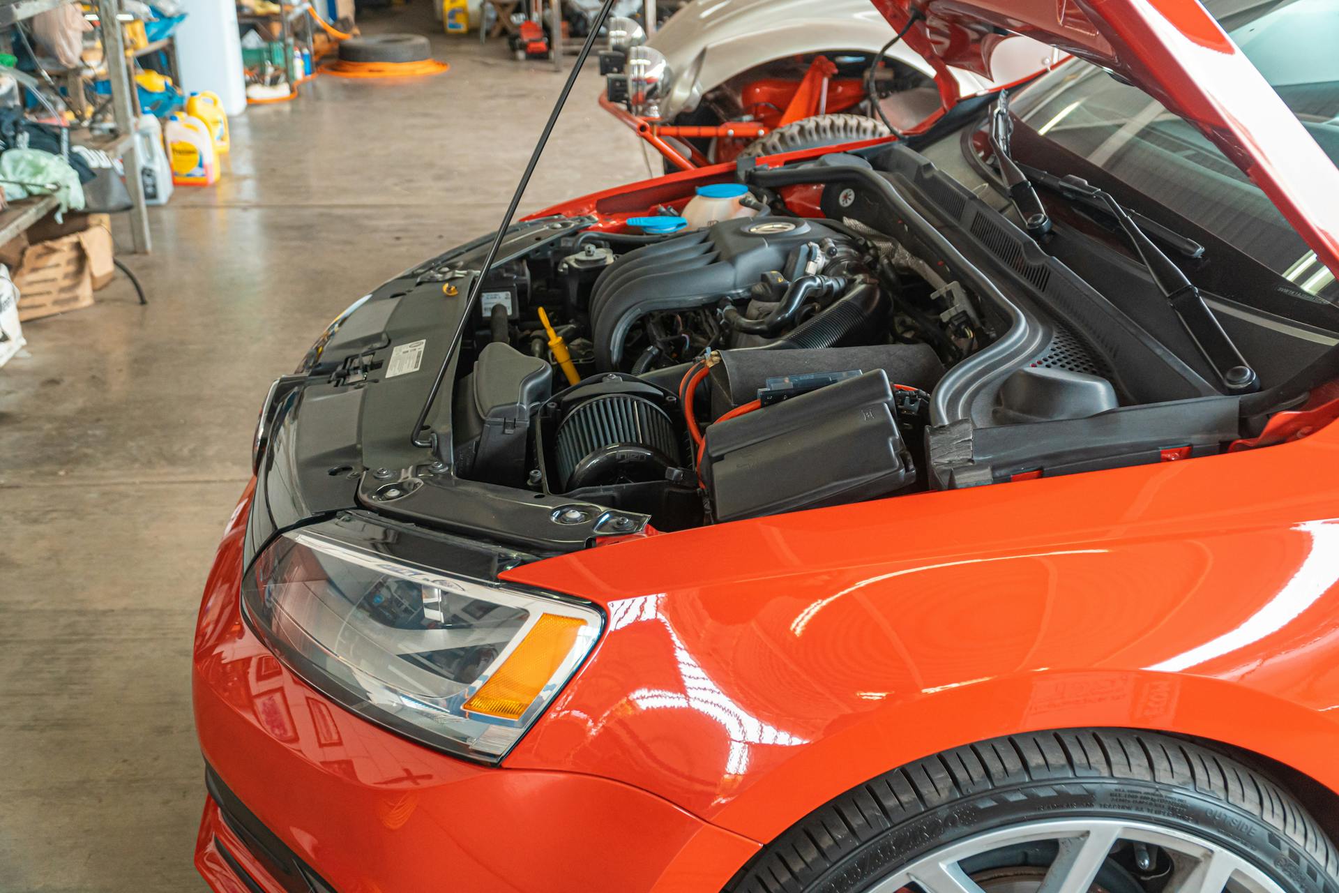 Engine bay being inspected during scheduled maintenance service